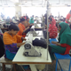 Many factories rely on the line system of production in which each worker is responsible for sewing a single small aspect of a larger garment. Photo by Sarah Labowitz.